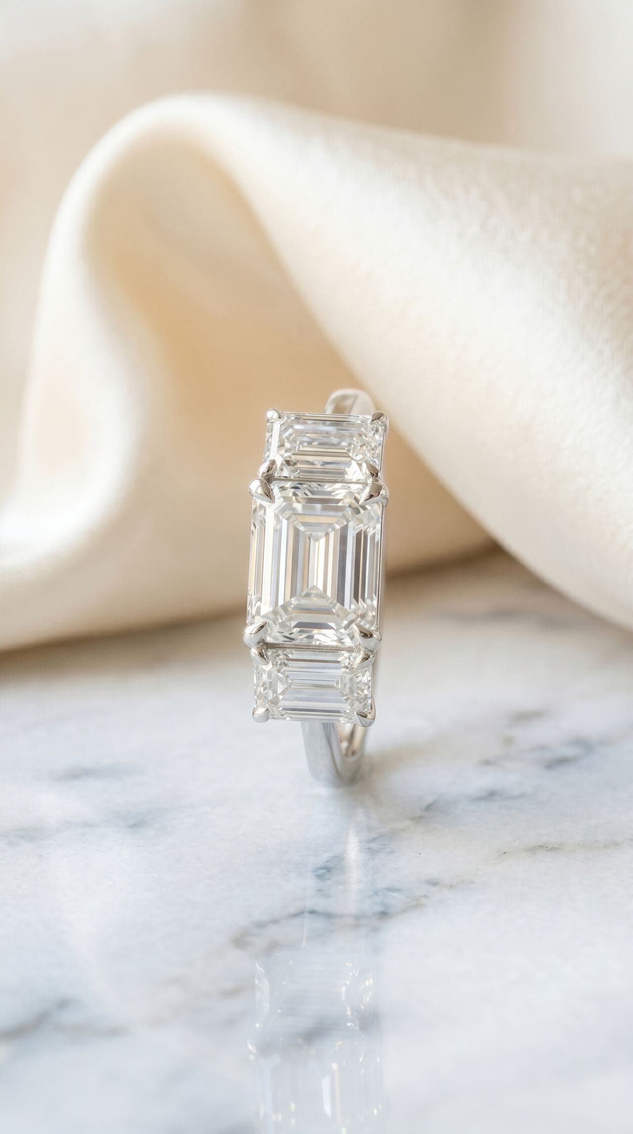 Bespoke diamond ring resting on marble
